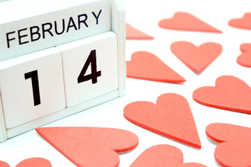 wooden calendar show of February 14 with red heart for valentine day background