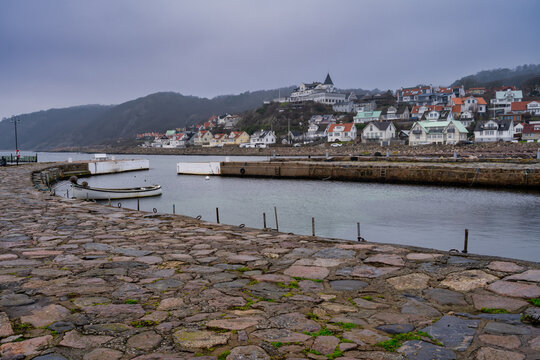 An empty marina in the winter. Mountains in fog in the background. Picture from Molle, Scania county, Sweden