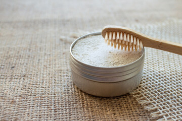 Natural bamboo toothbrushes and kaolin dentifrice or tooth powder made from natural ingredients on...