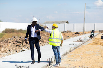 Foreman Construction and  Engineer team Working on workplace. Professional black architect and construction worker working on site. fabricating steel reinforcement bar