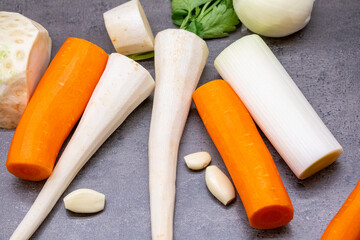 Vegetables for soup. Carrots, parsley, garlic, celery, onion. Fresh raw materials