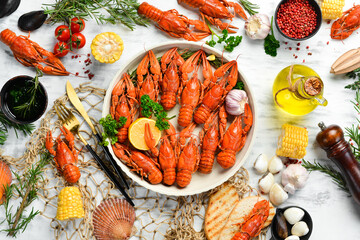 Crayfish. Red boiled crawfishes on table in rustic style, closeup. Lobster closeup. Seafood. Top...