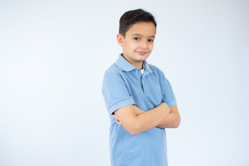 Smiling young boy with a happy gesture isolated on white background