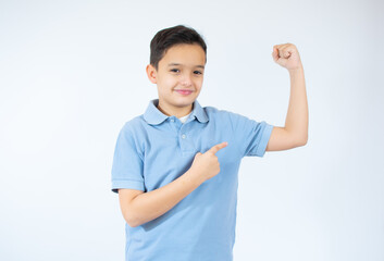 Boy is showing his arm muscles over white background.