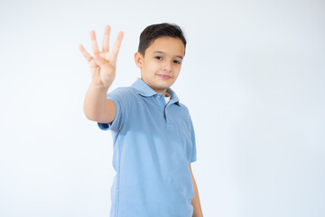 Beautiful kid boy wearing blue T-shirt standing over isolated white background showing and pointing up with fingers number four while smiling confident and happy