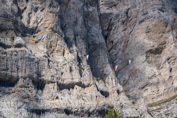 paragliders flying with moutain on the background