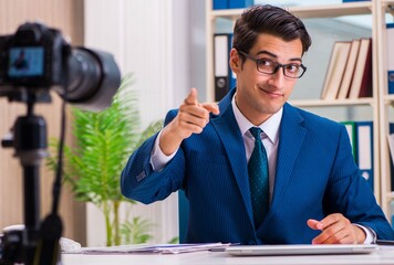 Businessman recording a video for vlog