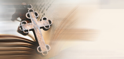 wooden cross on the book