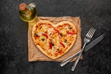 heart shaped pizza for valentine's day on stone background