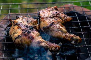 Chicken Legs Roasted On The Hot Flaming Charcoal Grill, Top View Close Up