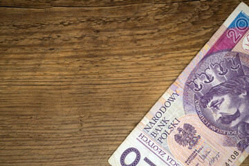 stylish copy space wint wooden background and polish zloty  bills
