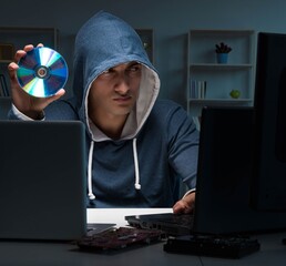 Hacker hacking computer at night