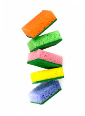 Close-up photo of multi-colored foam cleaning sponges on a white background