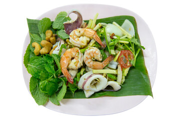 Spicy Seafood Salad with Squid and Shrimp, focus selective.