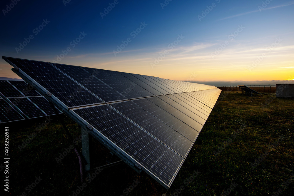 Wall mural photovoltaic cell on the background of sunset