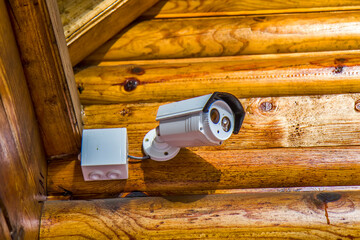 Security camera on the wooden house