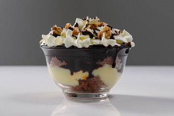 Creamy dessert with chocolate, vanella, whipped cream and walnut, called Somloi Galuska