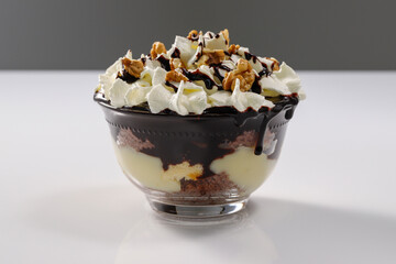 Creamy dessert with chocolate, vanella, whipped cream and walnut, called Somloi Galuska