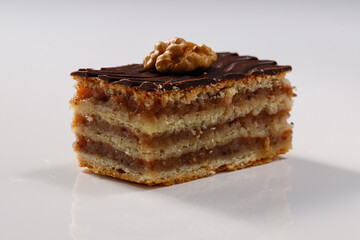 Layered cake with chocolate, walnut and apricot jam, called Zserbo
