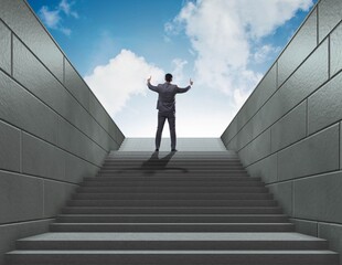 Businessman climbing up challenging career ladder in business co