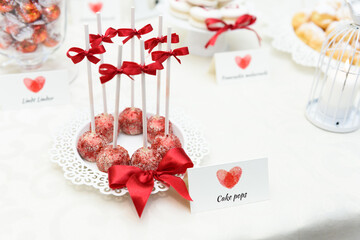Lovely cake pops on a sweet table at the wedding party