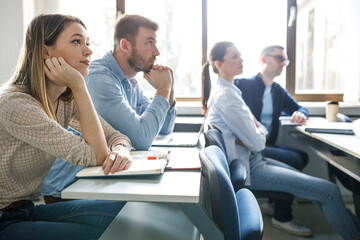 	
College students listen to professor's lecture in class room.	
