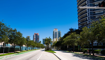 Road in Miami Beach. Expensive real estate in a beautiful southern city in Florida, street style.