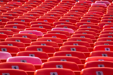 Abstract Background of Red Seats in Empty Stadium. Concept of Emptiness and Lock Down.
