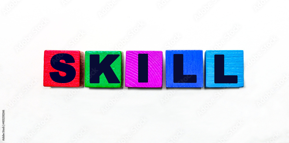 Poster the word skill is written on colorful cubes on a light background
