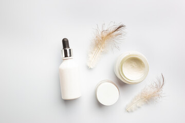 Flat lay composition with skin care products on white background