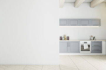 Fototapeta premium Panoramic gray kitchen interior with blank wall.