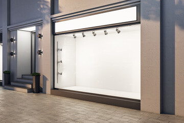 Modern  boutique with blank glass showcase and backlight lamps.