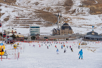 People skiing on the ski slope. Kayseri, Panoramic view of Erciyes,Turkey.