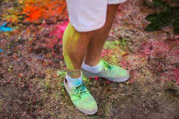 Shoes with Holi colors. Holi colour festival - Holi powder 