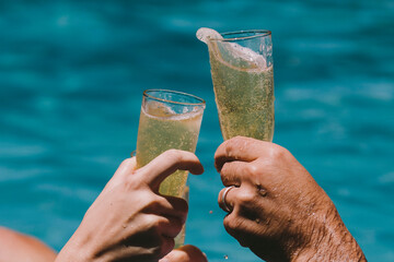 Toasting at a pool party