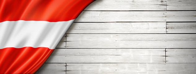 Austrian flag on old white wall banner