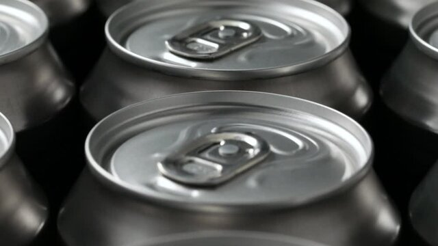  Rows of beer cans close up full frame as background