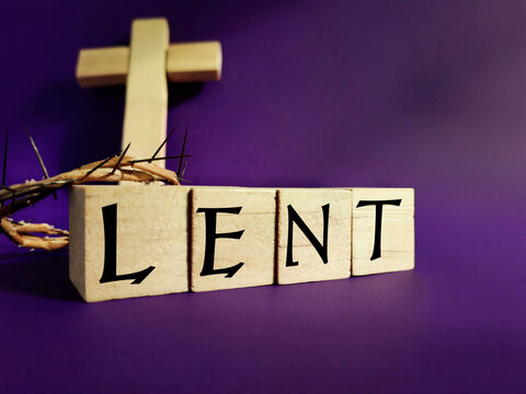 Lent Season,Holy Week and Good Friday concepts - word LENT on wooden blocks in purple color background. Stock photo.
