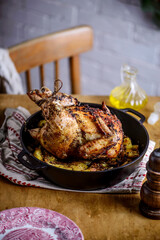 ROAST CHICKEN WITH potatoes.