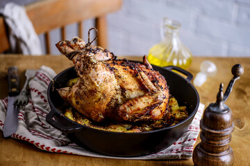 ROAST CHICKEN WITH potatoes.