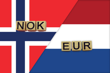 Norway and Netherlands currencies codes on national flags background