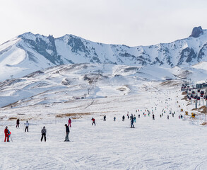 People skiing on the ski slope. Kayseri, Panoramic view of Erciyes,Turkey.