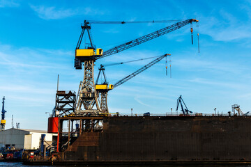 Fototapeta na wymiar Container cranes in the port of Hamburg, Germany