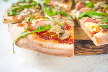 Pizza party concept.  Set of pizzas with various fillings, Pieces of different pizza, glass and bottle with wine. Flatlay top view copy space on white background