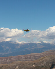 Yellow helicopter flying 