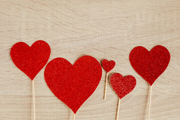 Red hearts shape on wooden table with copy space