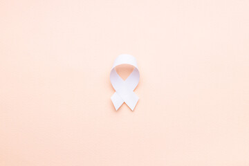 oncology and disease symbol cut out over pink background. above view. outer space