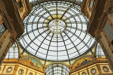 Glass dome of the gallery - Galleria Vittorio Emanuele II in Milan, Lombardy, Italy. Built between 1865 and 1877, it is an active shopping center for major fashion brands.