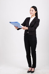 A business woman holding a blue folder
