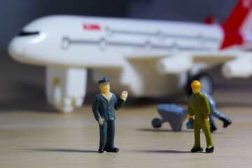 Airplane engineer, airport worker, aircraft people working in fixing, repairing the runway and checking the airplane. Many level of miniature company employee and employer figure as flight concept